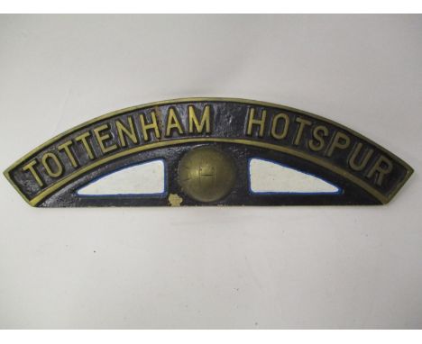 A vintage cast brass Tottenham Hotspur plaque with an arched top over a football, stamped Newton to the reverse, 4" h x 14"w 