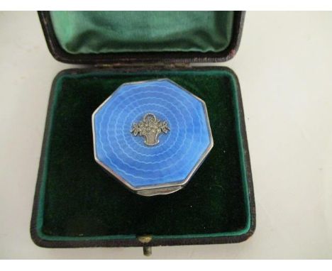 An Art Deco enamelled silver compact by George Stockwell London 1929, with import marts of octagonal form with engine turned 