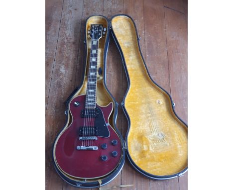 *A Hondo ll vintage Cherry Red Electric Guitar with case.