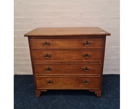A 19th century oak small four drawer chest on bracket feet, approx height 69cm, approx width 73cm.