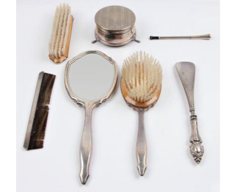 A hallmarked silver dressing table set, to include a jewellery box, a mirror, a clothes brush, a comb and hair brush, togethe