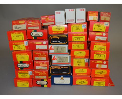 OO Gauge. Thirty two items of Rolling Stock and eight Carriages, all boxed, by Hornby, Tri-ang, Bachmann and others including