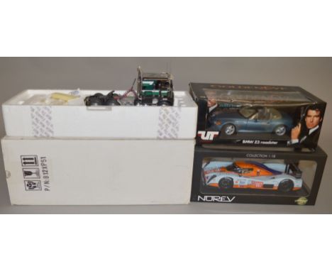 Two boxed diecast model cars in 1:18 scale, a UT Models James Bond 007 BMW Z3 Roadster and  an Aston Martin LMP1  'Gulf' mode