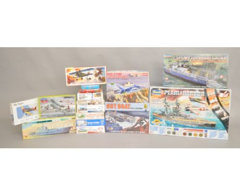 Sixteen boxed aviation and military model kits in a variety of different scales by Hasegawa, Academy, Trumpeter and others, i