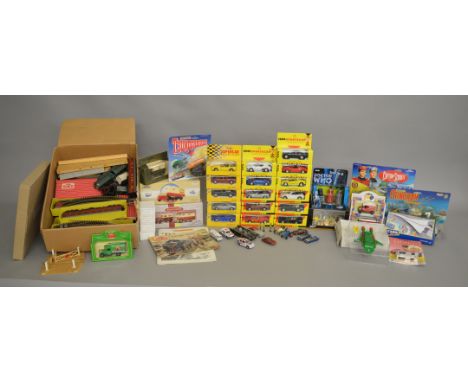 A mixed lot containing a quantity of boxed and carded diecast models by Corgi, Matchbox and others including a number of card