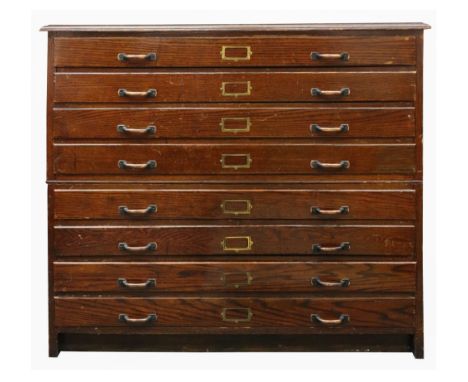 An oak plan chest, first half 20th century, with eight long drawers, in two parts, 121cm wide x 86cm deep x 110cm high.