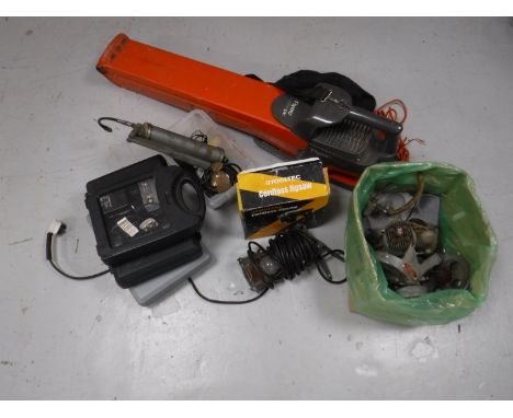 A dismantled Teagle cycle motor, car engine diagnostic equipment, compressor tester, tachometer, heavy duty grease gun, two L