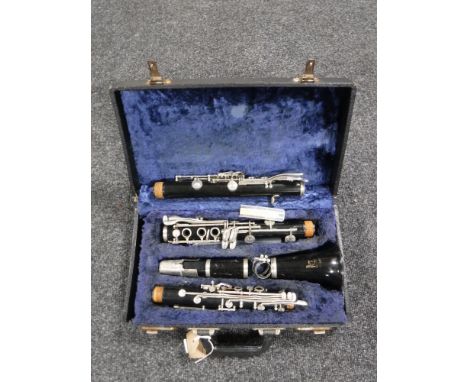 A cased Boosey & Hawkes clarinet (with extra parts) 