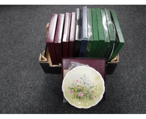 A box of thirteen boxed collector's plates - Royal Albert, Royal Worcester etc 