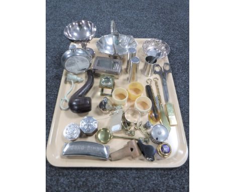 A tray of plated ware, pipe holder, napkin rings, mouth organ, whistles, antique brass lighter etc 