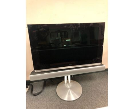 A Bang and Olufsen BeoVision 7 Mk V, 40 " screen, with separate soundbar speaker, on motorised adjustable stand, with Beo4 re