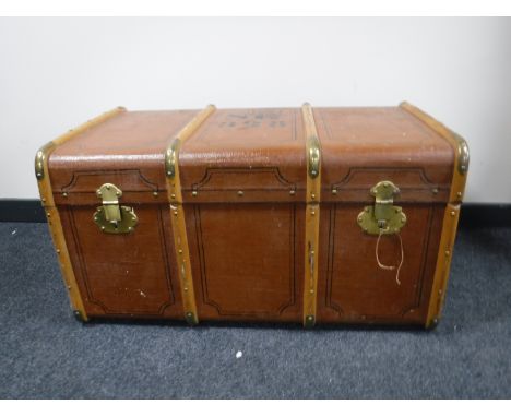 An early 20th century wooden bound trunk 