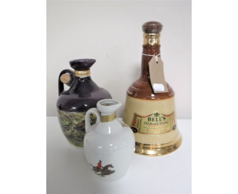 A Bells Wade Old Scotch Whisky decanter 75cl (sealed) and two Rutherford Deluxe Scotch Whisky decanters (sealed) 