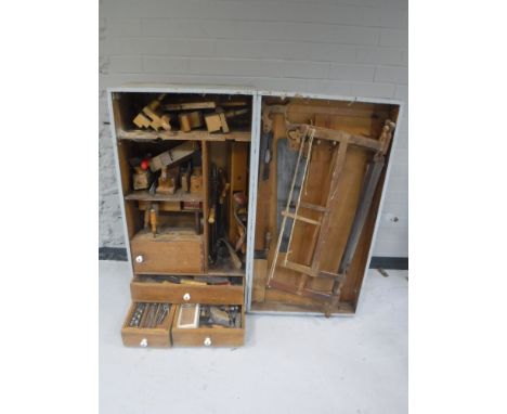 A mid 20th century joiner's tool cupboard containing a large quantity of  tools