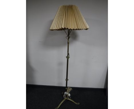 A Victorian brass rise and fall standard lamp 