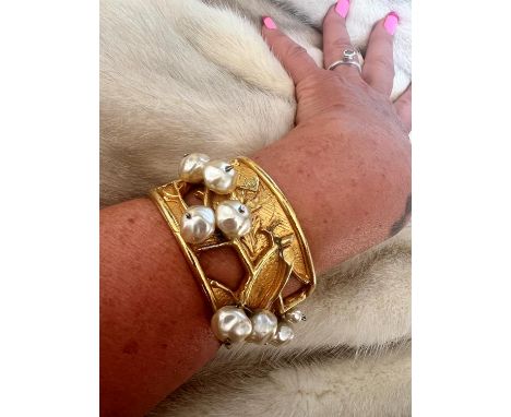 A PHILIPPE FERRANDIS, Paris, wide cuff bracelet/bangle, with gold plating and paired pearl beads placed among open heavily de