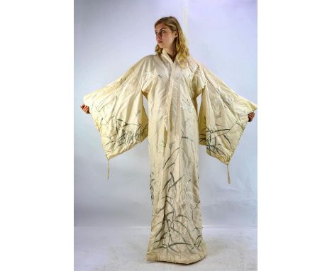 An elaborately embroidered cream silk Japanese late Shōwa era possibly wedding kimono depicting fine silk embroidery of white