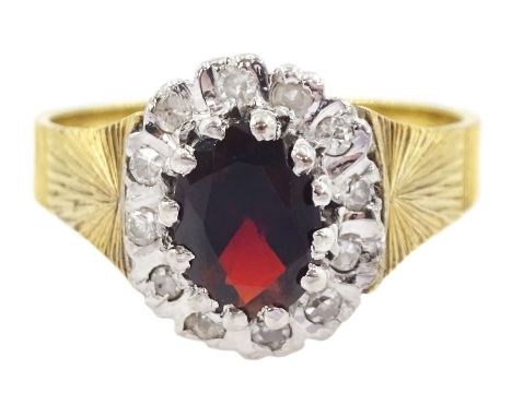 18ct gold oval cut garnet and diamond cluster ring, London 1975Condition Report:Approx 4.65gm, size M, overall head = 11.5mm 