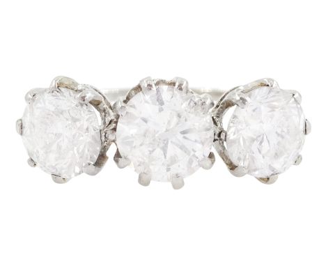 Platinum three stone diamond ring, the central diamond of approx 1.20 carat, the two side diamonds of approx 1.30 carat and 1