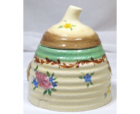 CLARICE CLIFF PRESERVE POT. Clarice Cliff floral lidded preserve pot, H: 11 cm