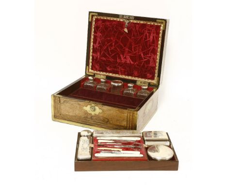 A George IV gentleman's rosewood and brass bound toilet box,various makers, London 1824/25,fitted with four toilet water bott