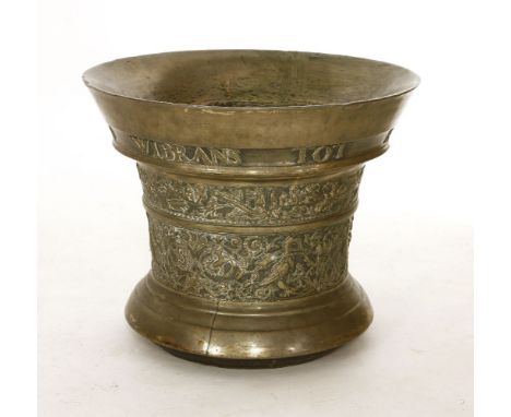 A massive Dutch bronze mortar,  rdated 1696, of tapering form, cast with a band reading 'Wibrans Tot Amsterdam 1696' above tw