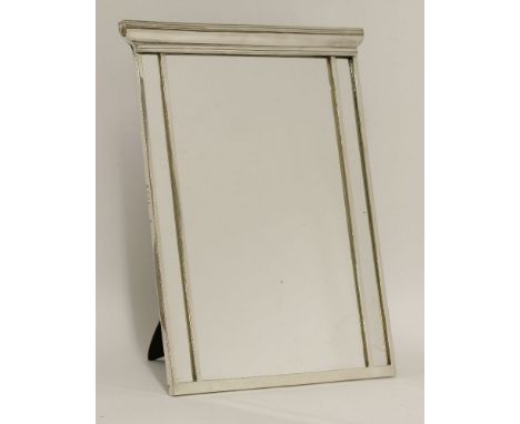 An Edward VII silver dressing table mirror,Richard Comyns, London, 1909,rectangular with a shaped reeded upper side, easel ba