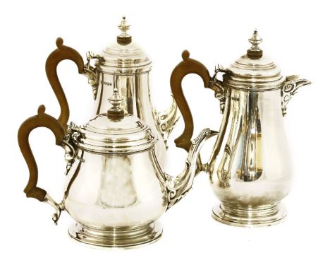 A Mappin and Webb silver three-piece tea set, by Mappin and Webb, Sheffield 1959, comprising of a teapot, coffee pot and hot 