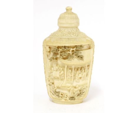 A large Chinese ivory snuff bottle,c.1880, carved in shaped panels with figures playing go or seated in a pavilion under pine