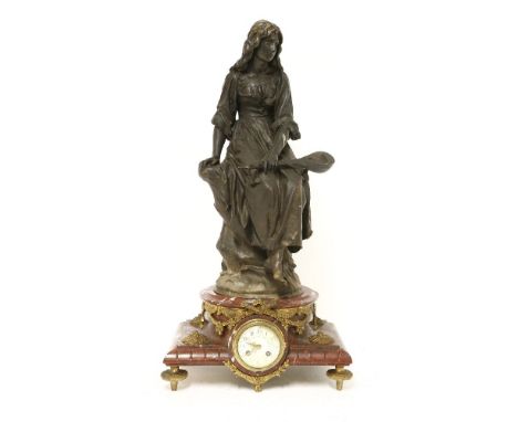 Paul Eugène Mengin (French 1853-1937),a bronze figure 'Femme a la Mandolin', standing on a red marble base with a clock inset