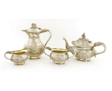 An Indian silver three-piece tea set, the handles formed as elephant's heads and trunks,together with a similar hot water jug