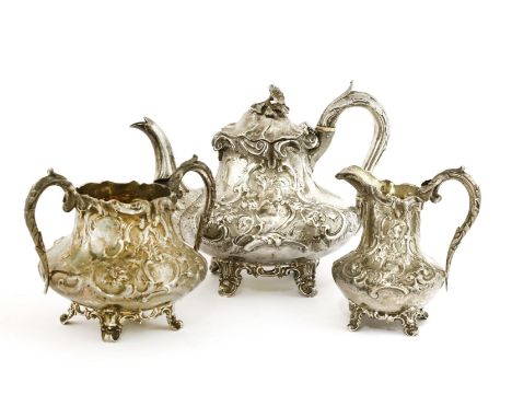 A Victorian silver three-piece tea service,William Hunter, London, 1842, comprising:a teapot with hinged lid and ivory insula