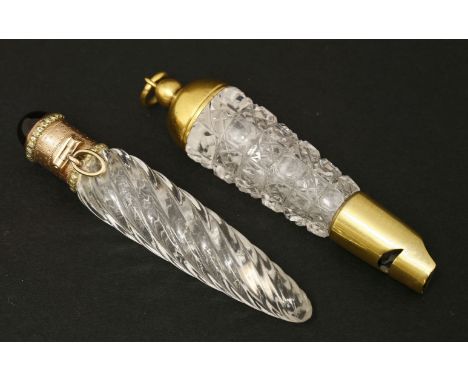 Two clear glass scent bottles,mid-19th century,one with a wrythen moulded body, below an engine turned two-colour gilt metal 