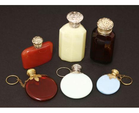 Six scent bottles,19th century, two with opaque blue bodies, one with a white metal cover impressed  'R Cooper Patent London'