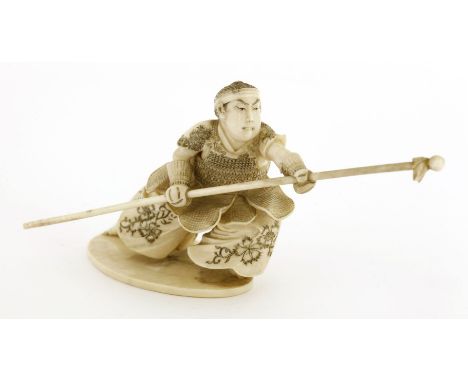 A Japanese ivory okimono,Meiji period (1868-1912), of a samurai practicing with a long stick, signed to base,8.5cm highProven