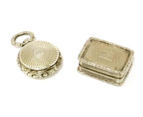 Two silver vinaigrettes,maker T.S., Birmingham 1838, with engine turned decoration and cast borders,2.6cm, andTS Birmingham 1