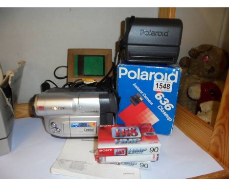 A Samsung camcorder, Polaroid Instant camera etc.,