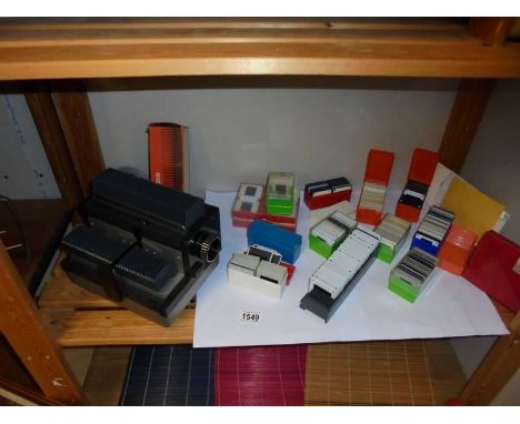 A slide projector and a quantity of slides.