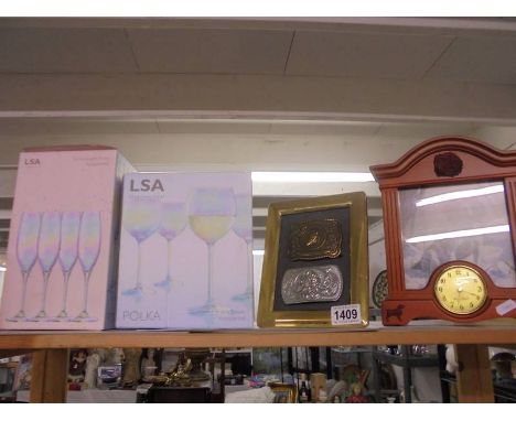 Two boxed sets of four glasses, a clock and one other item.