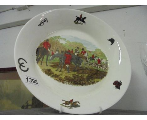 A large dish featuring a hunting scene.