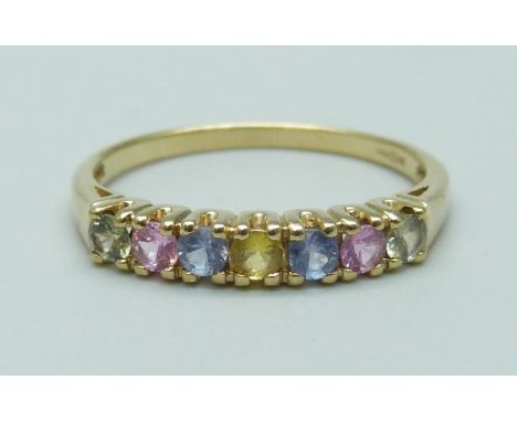 A 9ct gold ring set with coloured sapphires, 1.6g, O 