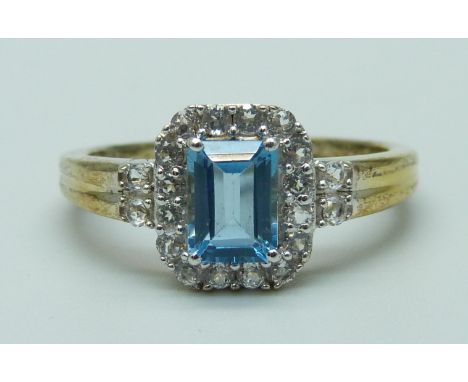A silver gilt, Swiss blue topaz and white stone ring, U 