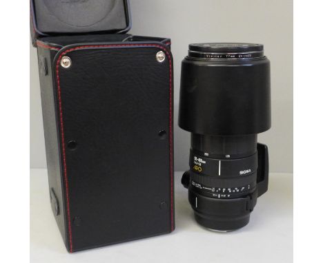 A Sigma 135-400mm lens, cased 