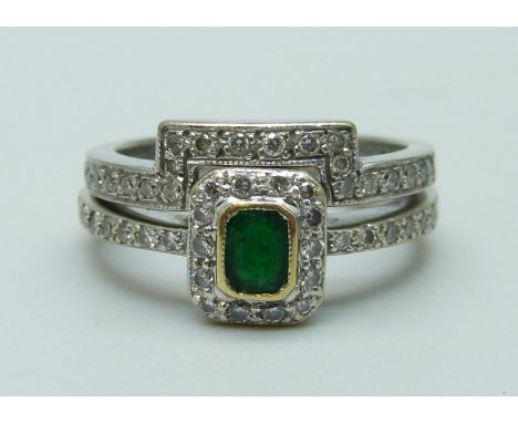 An 18ct white gold, diamond and emerald ring and a bespoke 18ct white gold and diamond ring, 6.6g gross weight, K/L 