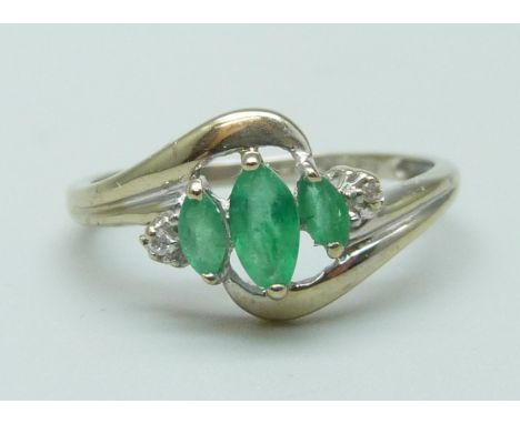 An 18ct white gold, emerald and diamond ring, 2g, N 