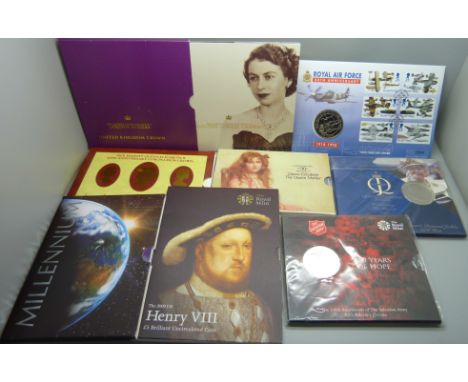 Eight commemorative £5 coin packs, including RAF, Henry VIII and Millennium 