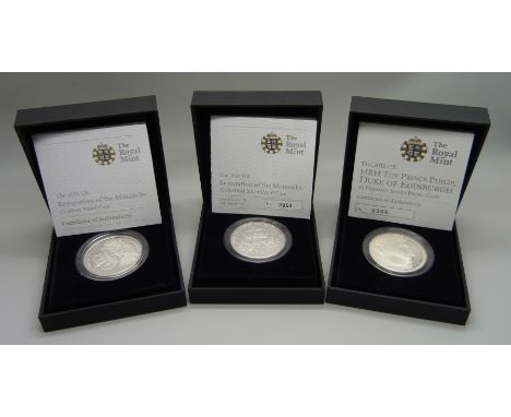 A £5 Piedfort silver proof coin, Restoration of The Monarchy, a Prince Phillip £5 Piedfort silver coin and a £5 silver Restor