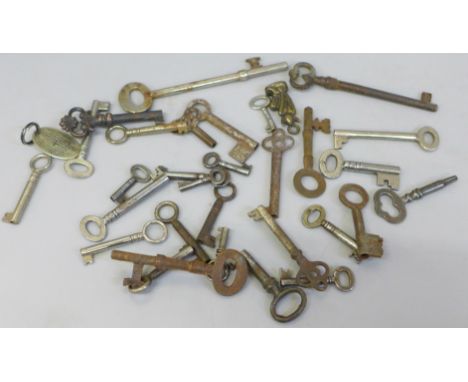 Thirty keys, clock, cabinet, caddy and door keys, with a brass Will box key fob and Lincoln imp key fob 