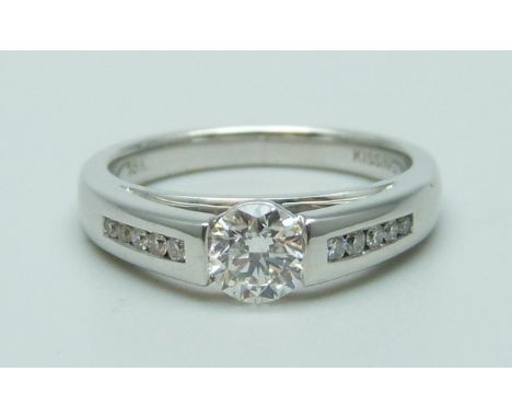 An 18ct white gold set 'Kissing Diamonds' ring, 0.59ct weight, Clarity SI1, Colour G, brilliant cut with Beaverbrooks diamond