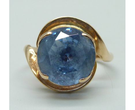 A yellow metal and blue stone set ring, marked 14 on the outside of the shank, 4.8g, Q 
